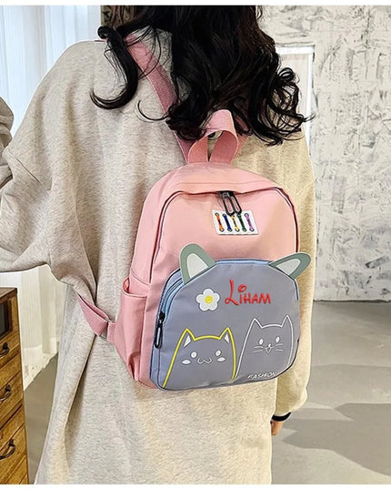 Schwarz-weißer Kita Rucksack mit Katzenmotiv - für Mädchen